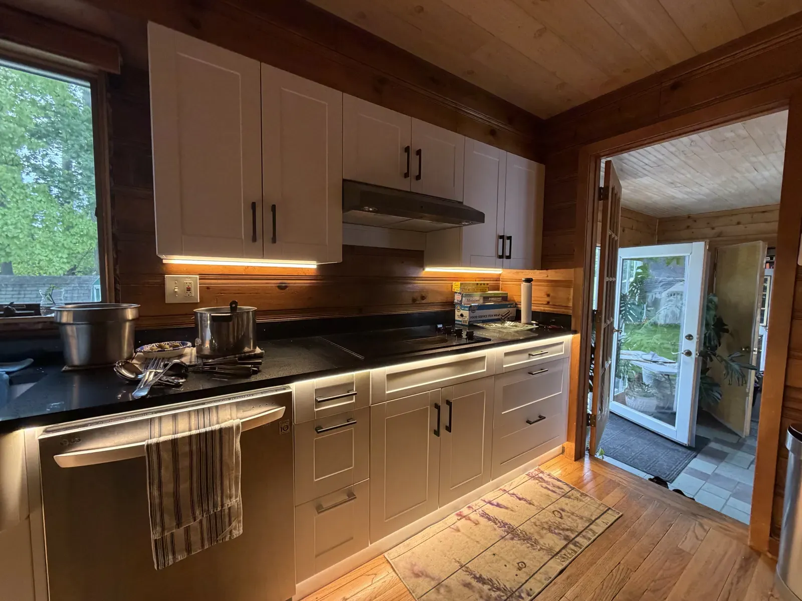 Under-cabinet LED lighting over the counter next to the back door
